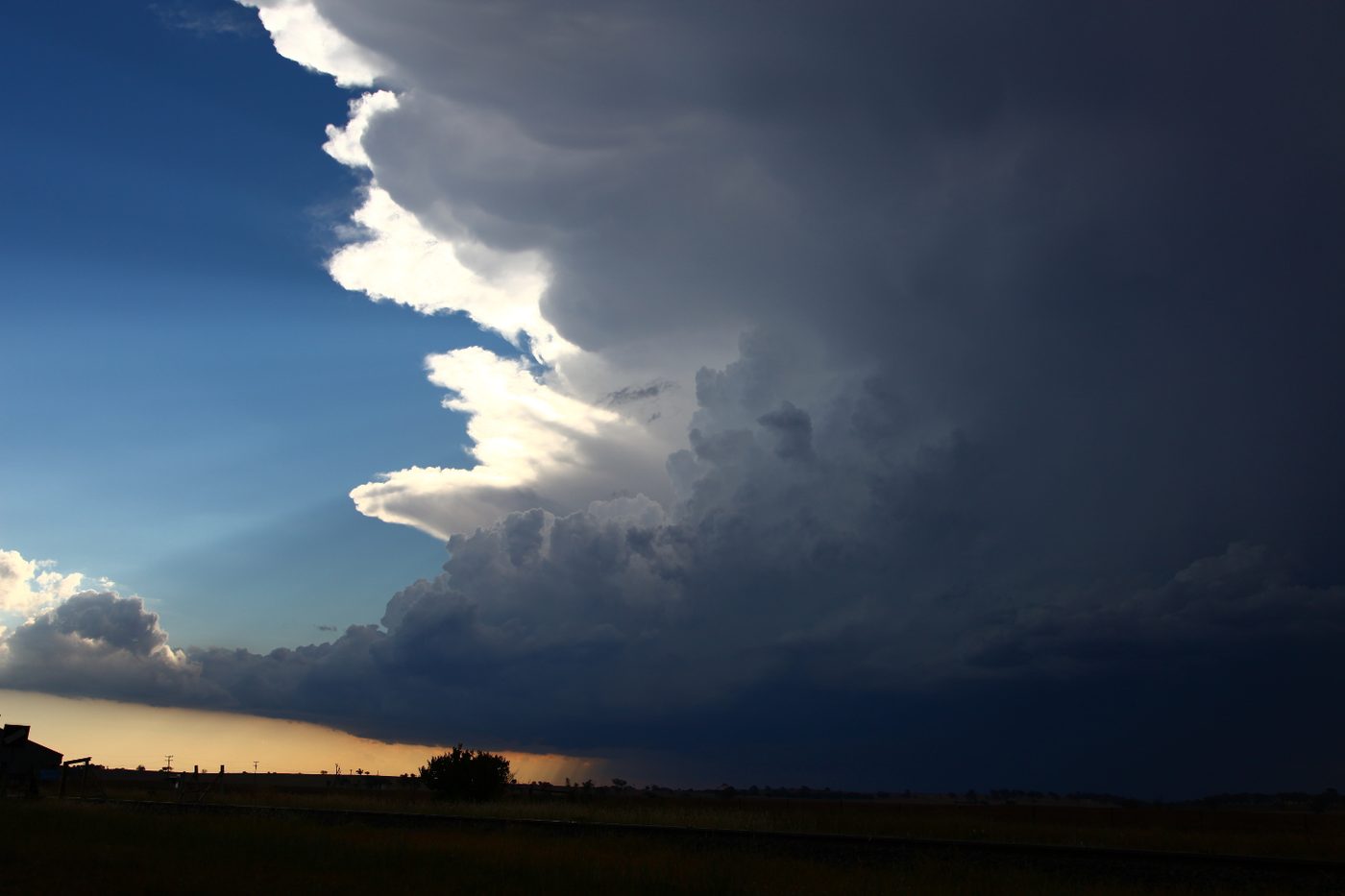 The layered, striated updraft of a supercell in late afternoon light
